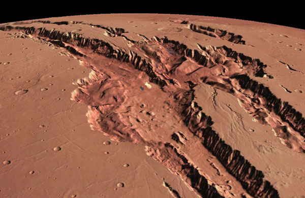 Valles Marineris, the largest canyon system in the solar system on Mars with a blimp aloft.